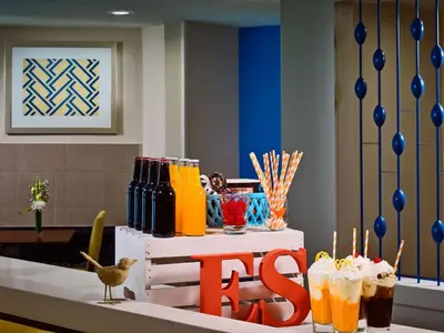 a table with drinks and a no sign on it at Sonesta Simply Suites Cleveland Westlake in Westlake