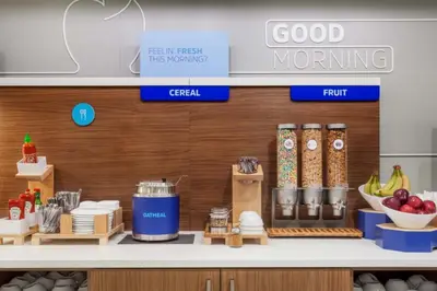 a store with a counter with food on it at Holiday Inn Express Hotel & Suites Dayton-Centerville by IHG in Centerville
