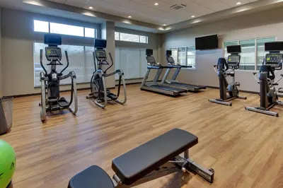 a gym with several treadmills and elliptical machines at Drury Inn & Suites Columbus Polaris in Columbus