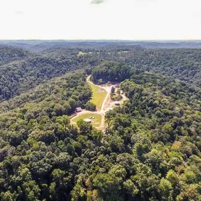 an aerial view of a park in the middle of a forest at The Highlander - Rustic Mountain Yurt in Genoa