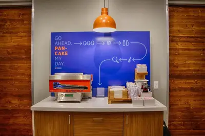 a table with a blue board with auclearuclearuclear at Holiday Inn Express Columbus South - Obetz by IHG in Obetz