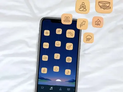 an iphone laying on a bed with icons on it at Sleep Inn & Suites Cross Lanes - South Charleston in Cross Lanes
