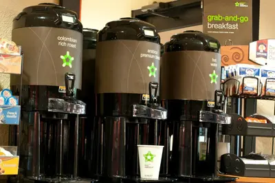 a group of bottles of coffee on a shelf at Extended Stay America Suites - Cincinnati - Florence - Turfway Rd in Florence