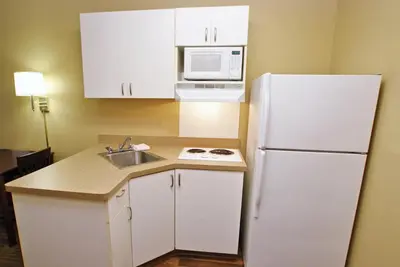a kitchen with a white refrigerator and a sink at Extended Stay America Suites - Cincinnati - Florence - Turfway Rd in Florence