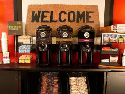 a store with a welcome sign on a counter at Extended Stay America Suites - Columbus - NE - I-270 in Gahanna
