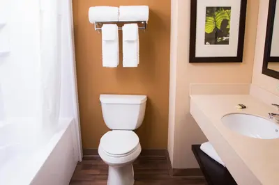a bathroom with a toilet and a sink at Extended Stay America Suites - Cincinnati - Covington in Covington