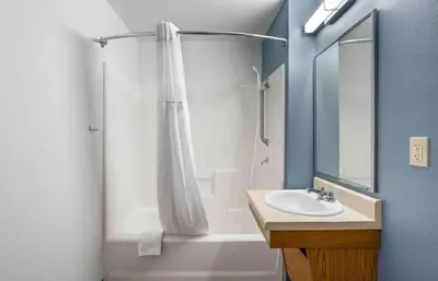 a bathroom with a shower curtain and a sink at Extended Stay America Select Suites - Cincinnati - Florence - Airport in Florence