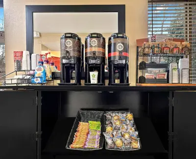 a shelf with drinks and snacks on it at Extended Stay America Suites - Toledo - Holland in Holland