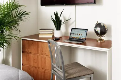 a desk with a laptop computer on top of it at InTown Suites Extended Stay Cincinnati OH - Colerain in Cincinnati