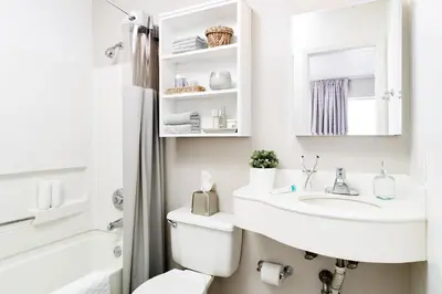 a white bathroom with a sink and a toilet at InTown Suites Extended Stay Columbus OH - Dublin in Columbus