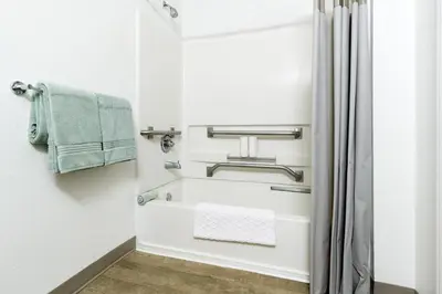 a bathroom with a towel rack and a shower at InTown Suites Extended Stay Columbus OH - Dublin in Columbus