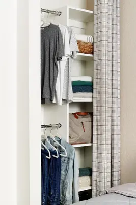 a closet filled with lots of clothes at InTown Suites Extended Stay Select Dayton OH- Miamisburg in Dayton
