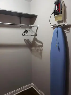 a room with a blue surfboard hanging on a wall at Modern Rustic split level with balcony in Cincinnati