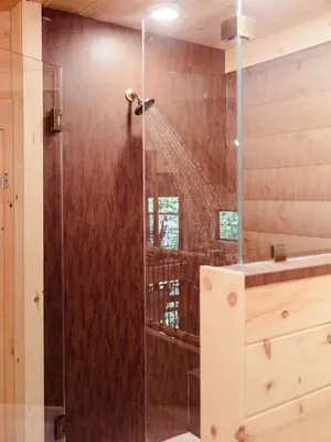 a shower in a bathroom with a shower at Skyview Treehouse by Amish Country Lodging in Millersburg