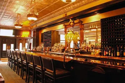a bar with a bunch of bottles of wine at Cute German Village LilHausCity ParkPetsOK in Columbus