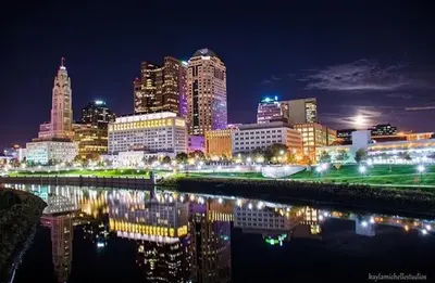 a city skyline at night with a river and buildings at Housepitality - The Southside Ranch in Columbus
