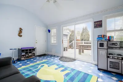 a living room with a couch and a kitchen at Bexley Family Friendly, Staycation, King Bed in Columbus