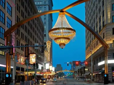 a large chandelier hanging over a city street at night at Cozy Cottage 10 mins to DTWN CLE Free Parking in Euclid