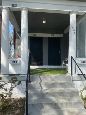 a front porch of a house with columns at Awesome Attic Studio Private Room 3A in Cincinnati